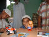 Wahab with a toy monkey